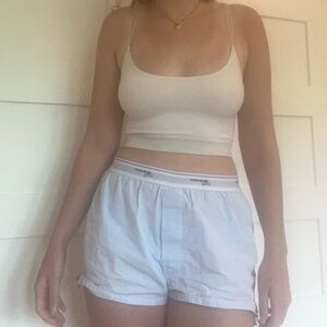Urban Outfitters out and under cropped tank top in black and a light pink cream